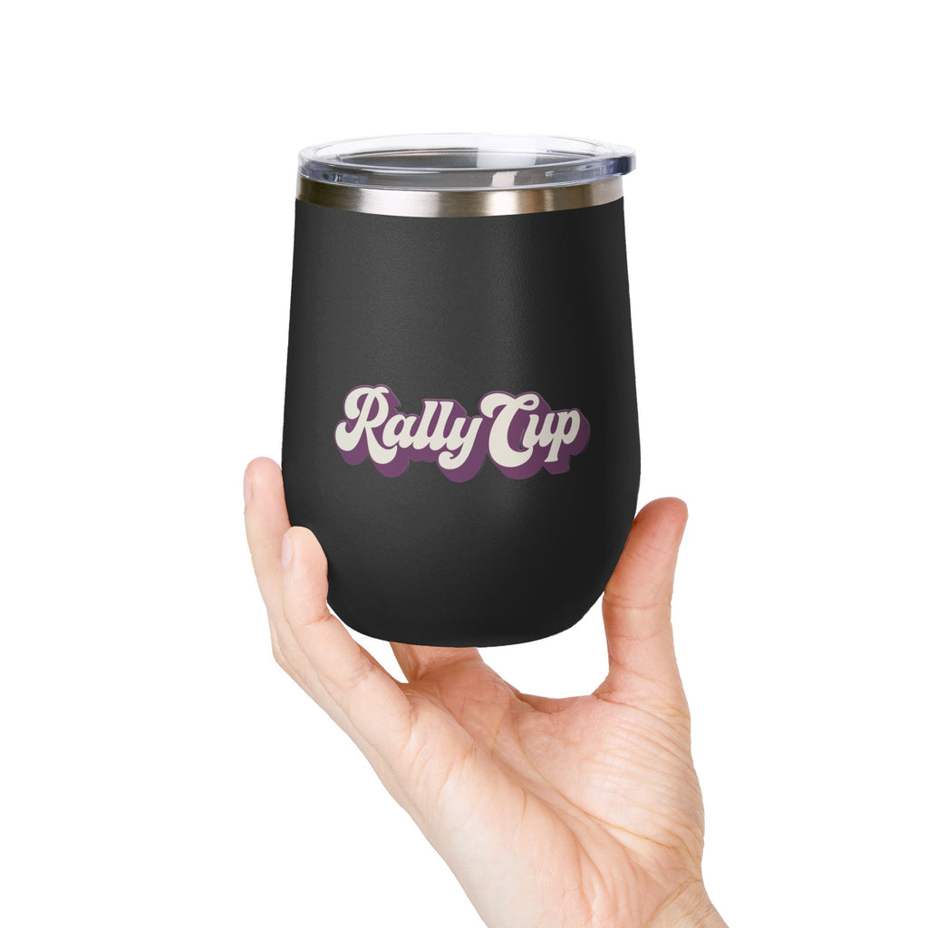 Hand holding a black Rally Cup 12oz stemless tumbler