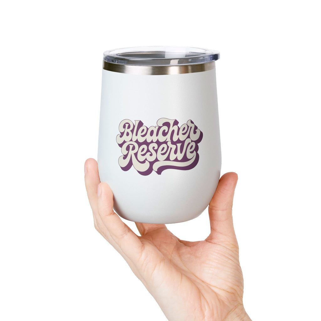Hand holding a white Bleacher Reserve 12oz stemless tumbler